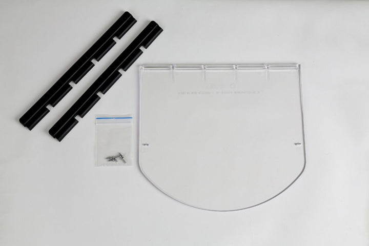 transcat dog door large Set of black plastic strips and a clear plastic sheet on a white background